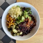 Fall Cobb Salad with mixed greens, bacon, Gruyère, roasted Brussels sprouts, squash, dried cranberries and maple vinaigrette at Olives Restaurant in East Grand Rapids