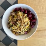 Grain bowl with coconut ginger rice, farro, Brussels sprouts, squash, corn, beets, red onion and maple glaze at Olives Restaurant in East Grand Rapids