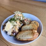 Tuscan meatballs in a creamy Tuscan sauce with Parmesan, basil and toasted baguette at Olives Restaurant in East Grand Rapids