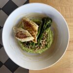 Seared walleye entrée with farro, broccolini, spinach, leek purée and lemon butter at Olives Restaurant in East Grand Rapids